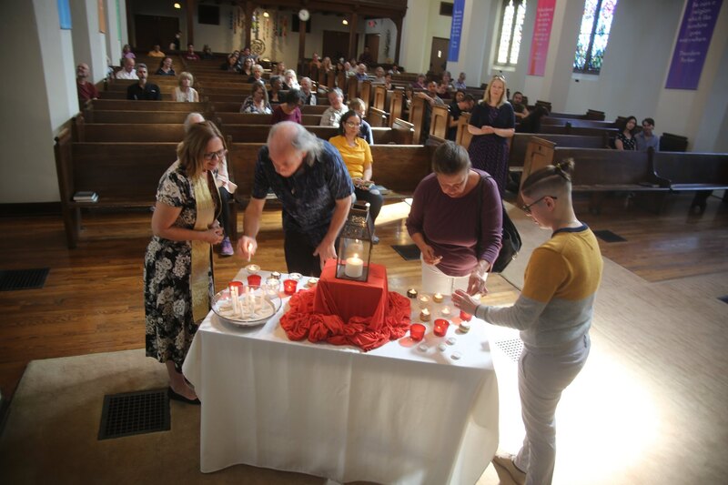 Assisting Rev. Tera Klein at Throop UU in a candle lighting ritual during Sunday service.